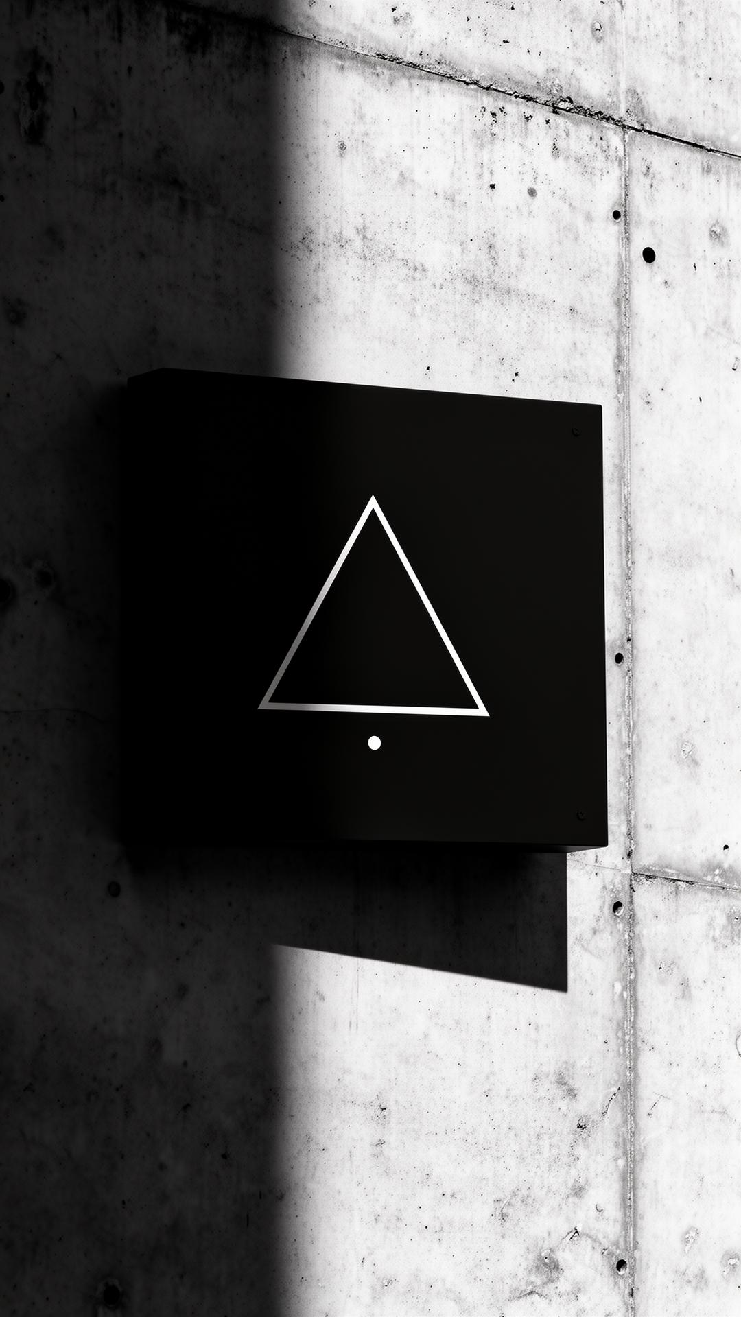 Axiora monogram signage mounted on a concrete wall